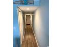 Light and airy hallway with wood-look flooring at 301 N Waccamaw Dr. # 211, Murrells Inlet, SC 29576
