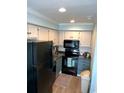 Well-equipped kitchen with modern appliances and ample cabinetry at 301 N Waccamaw Dr. # 211, Murrells Inlet, SC 29576