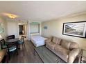 Living room with sofa bed, dining table, and ocean view at 201 S Ocean Blvd. # 714, Myrtle Beach, SC 29577