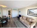 Beachfront condo living room with sofa, chairs, and ocean view at 201 S Ocean Blvd. # 714, Myrtle Beach, SC 29577