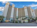 High-rise building, ocean view, palm trees, and signage at 4800 Ocean Blvd. S # 915, North Myrtle Beach, SC 29582