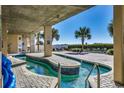 Relaxing lazy river pool with patio furniture at 1003 S Ocean Blvd. # 505, North Myrtle Beach, SC 29582