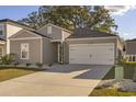 Eye-catching home with a white garage door and neat landscaping at 1104 Saltgrass Way, Myrtle Beach, SC 29588