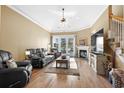 Relaxing living room with fireplace, hardwood floors and access to a deck at 283 Shoreward Dr., Myrtle Beach, SC 29579