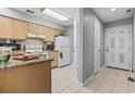 Galley kitchen with light wood cabinets and granite countertops at 4101 Pinehurst Circle # 4A, Little River, SC 29566