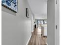 Bright hallway with wood-look floors leading to living areas at 4103 Pinehurst Circle # Bb-14, Little River, SC 29566