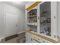 Entryway with a white door and an ornate wooden hutch at 4818 Innisbrook Ct. # 603, Myrtle Beach, SC 29579