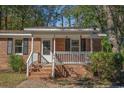 Brick ranch house with a white porch and a bird feeder at 538 Oak Circle Dr., Myrtle Beach, SC 29588