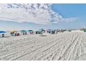 Beachfront view with colorful umbrellas and people enjoying the sun at 7200 N Ocean Blvd. # 758, Myrtle Beach, SC 29572