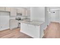 Open concept kitchen with granite countertops and stainless steel appliances at 310 Sandridgebury Dr. # 40, Little River, SC 29566