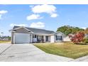 This lovely house boasts a spacious front yard with mature trees and a welcoming entrance at 8417 Tartan Ln., Myrtle Beach, SC 29588