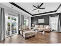 Spacious living room with hardwood floors, comfy seating, and access to a balcony at 140 Splendor Circle, Murrells Inlet, SC 29576