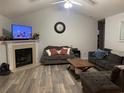 Living room features a fireplace and plenty of seating at 706 Wintercreeper Dr., Longs, SC 29568