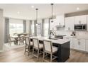 Spacious kitchen with white cabinets, an island, and stainless steel appliances at 7071 Denim Loop, Myrtle Beach, SC 29575