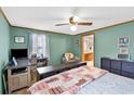 Comfortable bedroom featuring a ceiling fan and workspace at 1103 Blue Ridge Trail, North Myrtle Beach, SC 29582