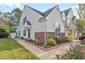 Side view of a charming townhome with well-maintained landscaping at 140 Wimbledon Way # 140, Murrells Inlet, SC 29576