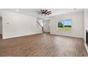 Spacious living room with hardwood floors and a view of the kitchen at 1503 Red Bluff Rd., Loris, SC 29569