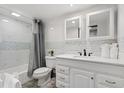 Clean bathroom with white vanity, grey shower curtain, and mosaic backsplash at 2001 S Ocean Blvd. # 916, Myrtle Beach, SC 29577