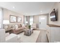 Bright living room featuring hardwood floors and ample natural light at 301 Bent Green Ct. # 84F, Murrells Inlet, SC 29576