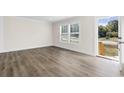 Bright living room featuring wood-look flooring and an open floor plan at 3641 Wayside Rd., Conway, SC 29527
