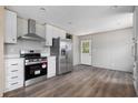 Modern kitchen with stainless steel appliances and white cabinets at 3811 Wayside Rd., Conway, SC 29527