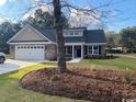 Two-story house with a large front yard and mature trees at 4151 Salem Rd., Aynor, SC 29511