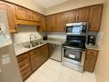 Kitchen features wood cabinets, granite countertops, and stainless steel appliances at 55 Freedom Way # 55, Myrtle Beach, SC 29577