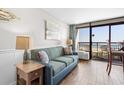 Living room with ocean view and comfortable sofa at 6804 Ocean Blvd. # 331, Myrtle Beach, SC 29572