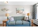 Living area featuring a sofa and coastal decor at 6804 Ocean Blvd. # 331, Myrtle Beach, SC 29572