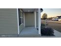 Small front porch with gray siding and white columns at 106 Ivy Creek Ct., Conway, SC 29527