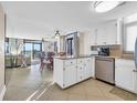 Open concept kitchen with granite island and ocean view at 5910 N Ocean Blvd. # 504, North Myrtle Beach, SC 29582