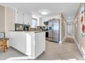 Kitchen features granite countertops and stainless steel appliances at 5910 N Ocean Blvd. # 504, North Myrtle Beach, SC 29582