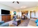 Open living and dining area with large windows and hardwood floors at 8121 Amalfi Pl. # 4-1203 A&B, Myrtle Beach, SC 29572