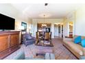 Open living and dining area with large windows and hardwood floors at 8121 Amalfi Pl. # 4-1203 A&B, Myrtle Beach, SC 29572