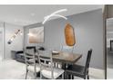 Bright dining area with a modern table and chairs at 305 S 21St Ave. S # 112, Myrtle Beach, SC 29577