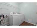 Laundry room with washer, dryer, and storage shelving at 5027 Billy K Trail, Myrtle Beach, SC 29579