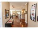 Long hallway with hardwood floors and view into the living area at 126 Lakeside Crossing Dr., Conway, SC 29526