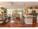 Open concept living area with hardwood floors and kitchen island at 126 Lakeside Crossing Dr., Conway, SC 29526