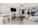 Living area with dining table and open kitchen access at 2701 S Ocean Blvd. # 1808, North Myrtle Beach, SC 29582