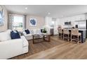 Open concept kitchen with island, stainless steel appliances, and hardwood floors at 2705 Rowyn St., Longs, SC 29568