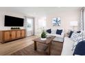 Spacious living room with hardwood floors and neutral color palette at 2709 Rowyn St., Longs, SC 29568