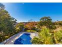 Community pool with surrounding landscape at 311 69Th Ave. N # 302, Myrtle Beach, SC 29572