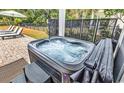 Relaxing hot tub with bubbling water, steps, and a cover at 28 Pinnacle Dr., Murrells Inlet, SC 29576