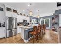 Modern kitchen with white cabinets, stainless steel appliances, and an island with seating at 28 Pinnacle Dr., Murrells Inlet, SC 29576