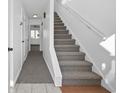 Carpeted staircase leading to the upper level of the home at 310 Lakeside Dr. # C, Surfside Beach, SC 29575