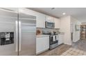 Modern kitchen with stainless steel appliances and white cabinets at 71 Arbor Crest Ln., Tabor City, NC 28463