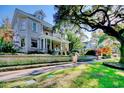 Stone home with a wrap-around porch and beautifully landscaped yard at 116 Saint James St., Georgetown, SC 29440
