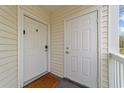 Exterior condo entry with two doors and a mat at 1238 River Oak Dr. # D, Myrtle Beach, SC 29579