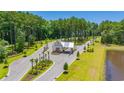 Aerial view of community entrance with guardhouse and landscaping at 2218 Vera Way, Longs, SC 29568