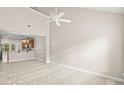 Spacious living room with high ceilings, carpeting, and a view into the kitchen at 230 Pilot House Pl. # 230, Carolina Shores, NC 28467